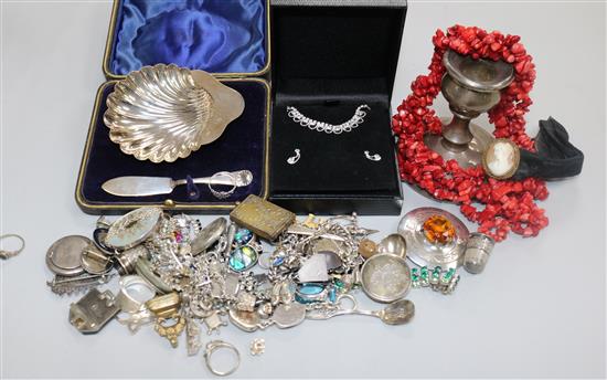 A quantity of silver and costume jewellery, a silver dwarf candlestick and a cased silver butter shell and knife.